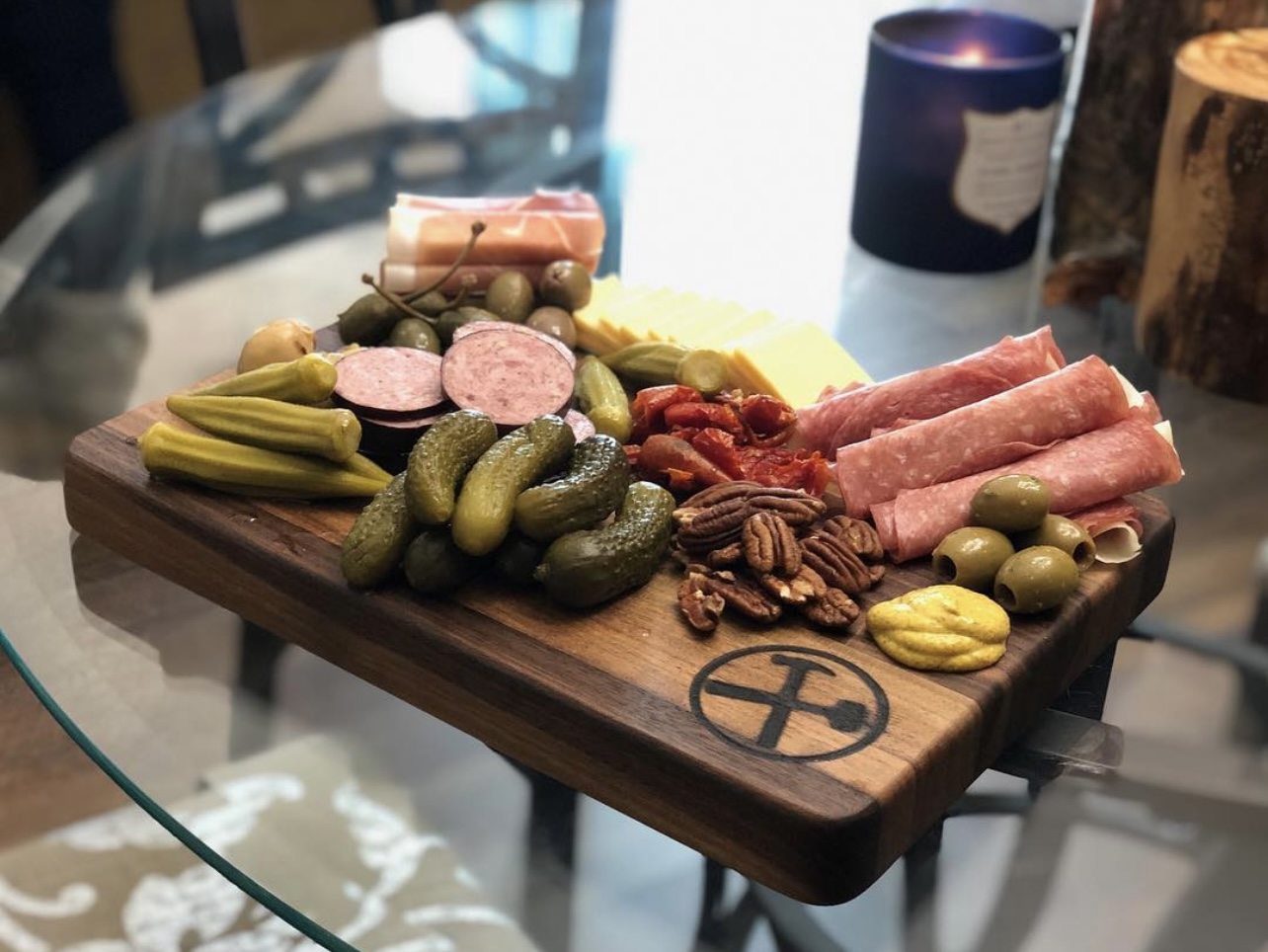 Hand made cutting board with charcuterie and accompaniments