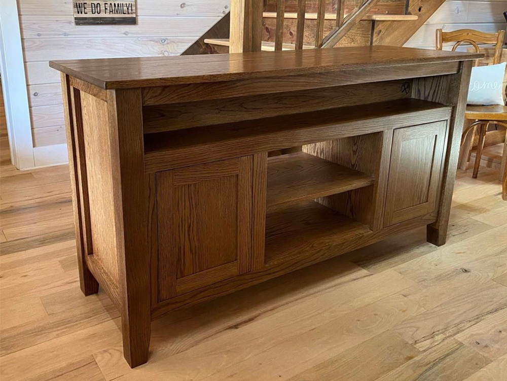 Medium dark wood entertainment stand after completion